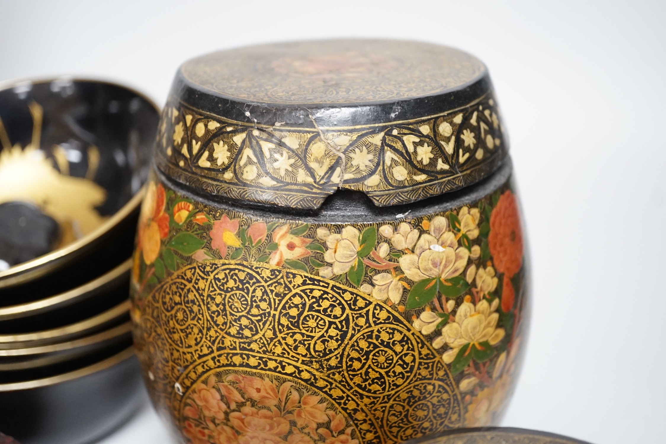 A Japanese red lacquer natsume, 7cm high, and matching tea cup Together with Mixed decorative Oriental and Indian lacquer wares and, a Chinese carved hardwood figure of a sage 39.5cm